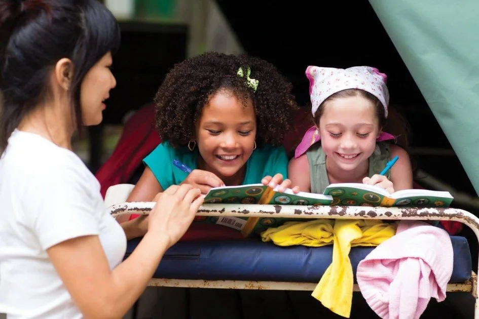 Together Counts Girl Scouts Reading at Camp Out