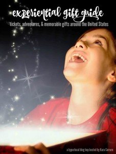 Little girl opening a magical christmas gift against snow