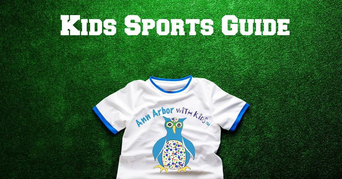 Ann Arbor Kids Sports Guide - sports t-shirt sporting Ann Arbor with Kids logo laying on a grass field sporting