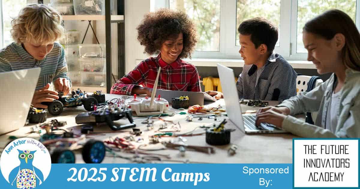 2025 STEM Camps Sponsored by The Future Innovators Academy - 4 kids sitting at a table working with robotic elements and programming on computers