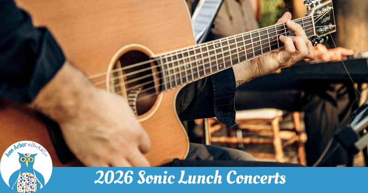 2026 Sonic Lunch Lineup - Closeup of a hand strumming a guitar