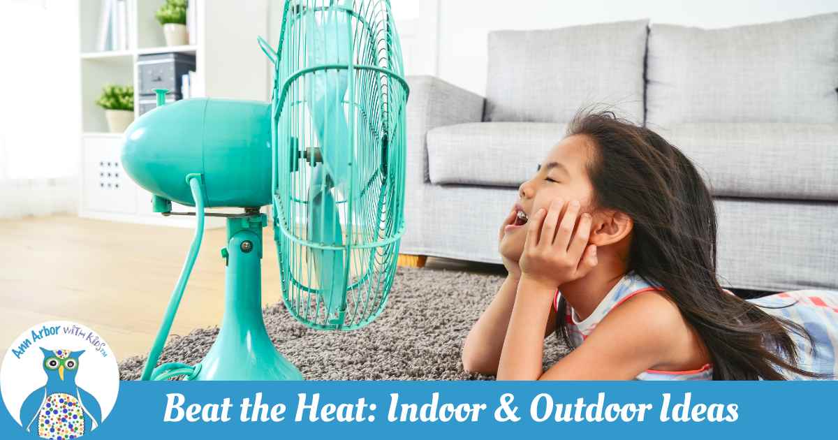Ann Arbor Beat the Heat: Indoor & Outdoor Ideas - a girl lays on the floor with her face in front of an oscillating fan
