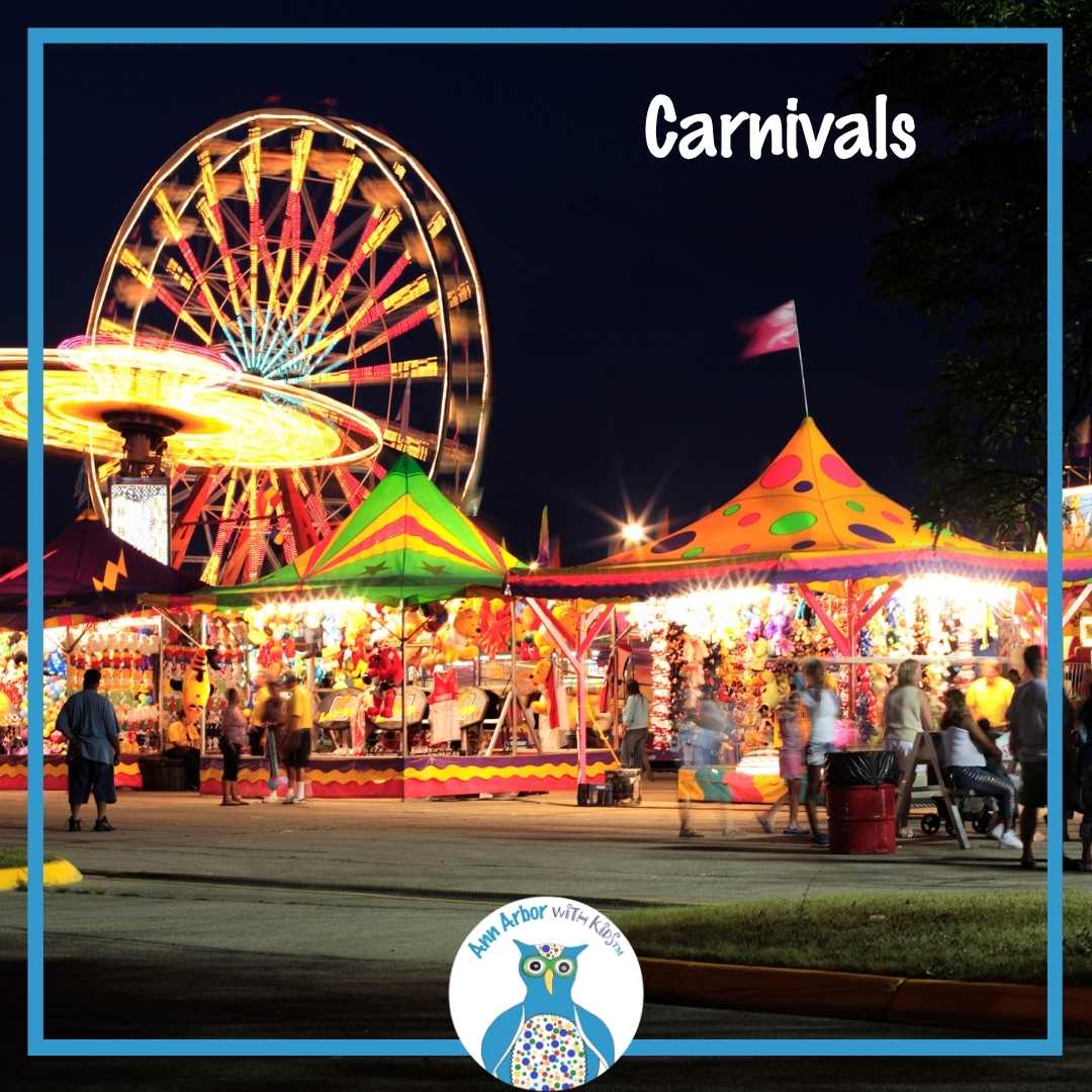 Carnivals - Carnival Midway lit up at night with a Ferris Wheel tented rides, and games