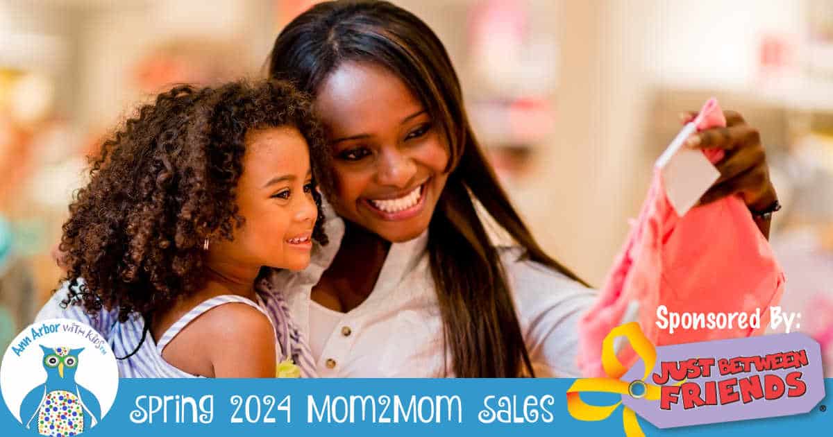 Ann Arbor Mom2Mom Sales Spring 2024 - Sponsored by Just Between Friends - Mom & daughter look at clothes
