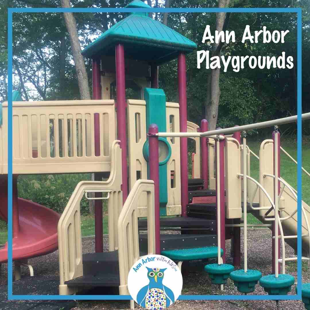 Ann Arbor Playgrounds -a play structure with floating islands, stairs, and a covered platform in front of woods