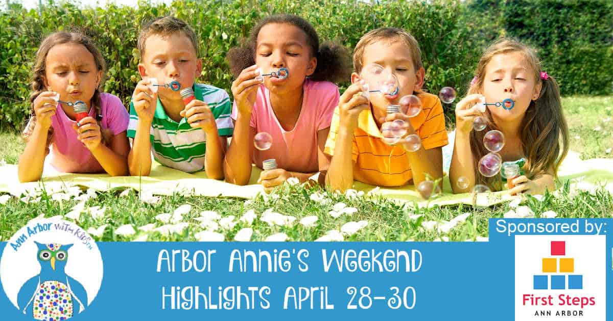 Arbor Annie's Weekend Highlights April 28-30 Sponsored by First Steps Ann Arbor - Picture of Kids laying in grass propped on their elbows blowing bubbles
