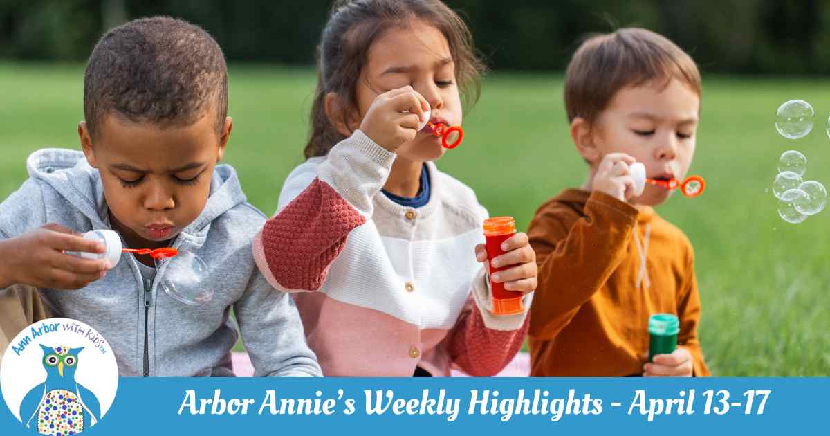 Arbor Annie's Weekly Highlights - April 13-17 - three kids sit on the grass blowing bubbles
