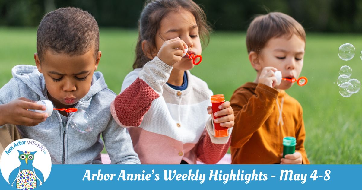 Arbor Annie's Weekly Highlights - May 4-8 - three kids sit on the grass blowing bubbles