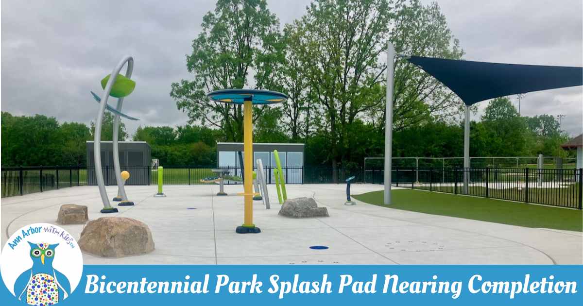 Bicentennial Park Splash Pad Nearing Completion - Splash Pad without water - dumper bucket, shower sprayer, ground jets, water hoops, water table, shade sail, and more