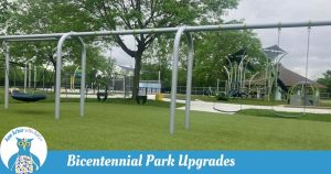 Bicentennial Park Upgrades - 2026 New Additions - Swings including saucer, baby, and regular, play structure with merry go rounds, and splash pad in the distance