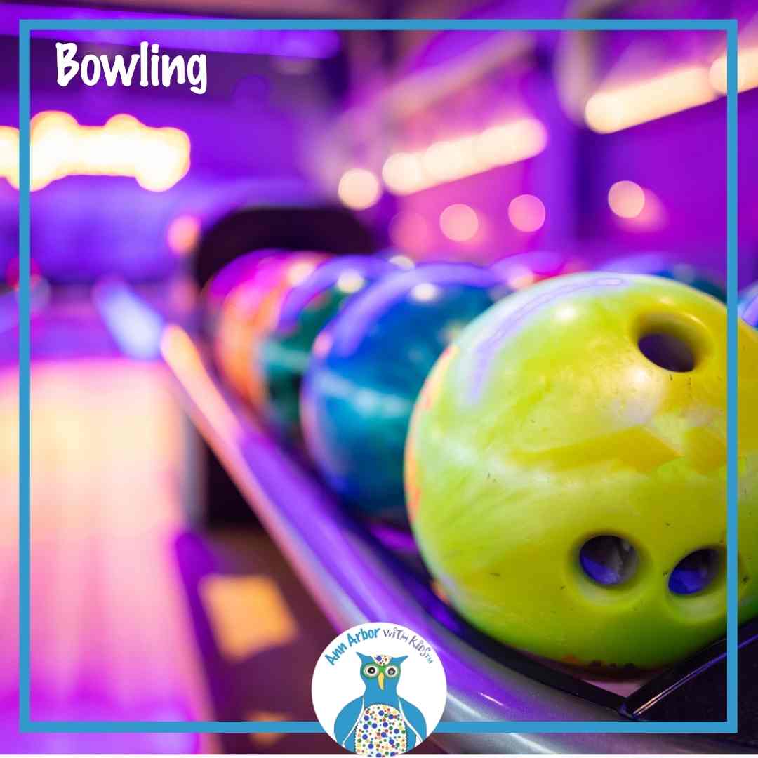 Ann Arbor Bowling Alleys - closeup of bowling balls on the rack in a glow bowling lane