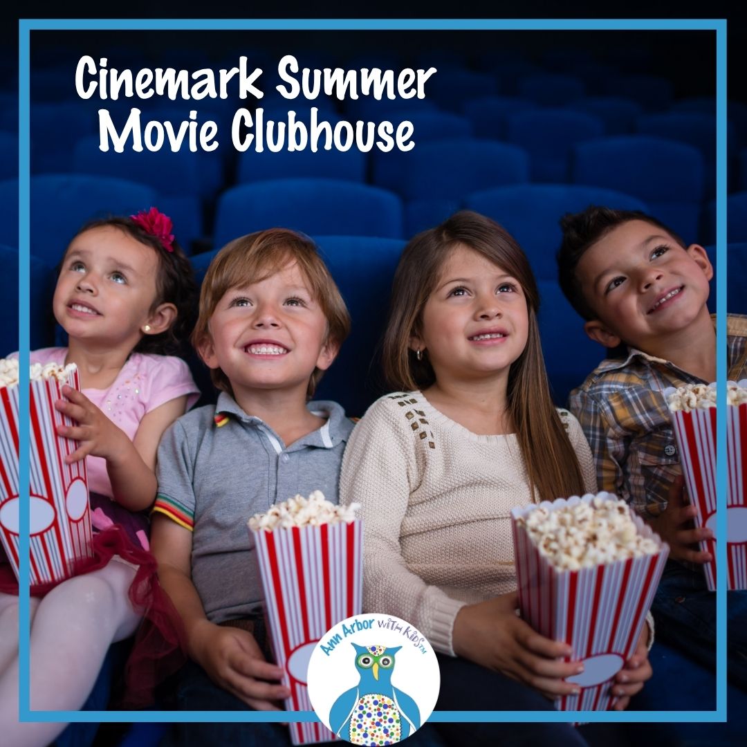 Cinemark Summer Movie Clubhouse - a group of kids sits in a movie theater with popcorn & watching the screen