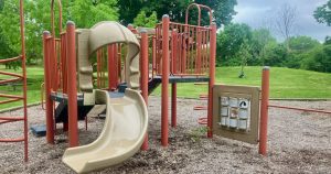 Ellsworth Park - Structure showing a slide with a 90 degree turn a 3x3 grid of spinners with information on animals