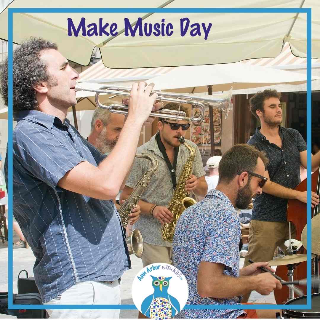 Make Music Day - a band of men plays various instruments under a large umbrella - sax, drums, trumpet, bass