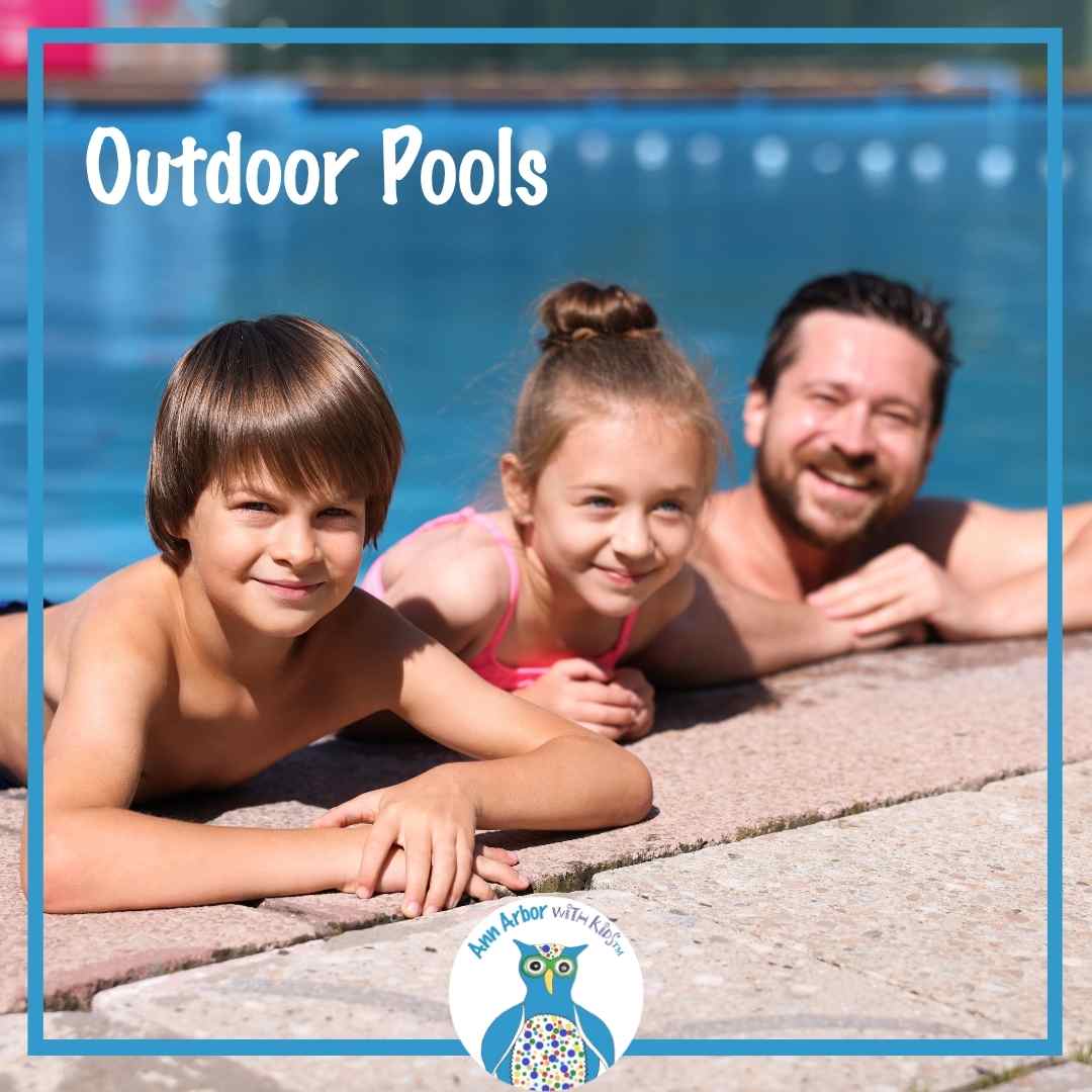 Outdoor Pools - a father & two kids hang on the edge of an outdoor pool