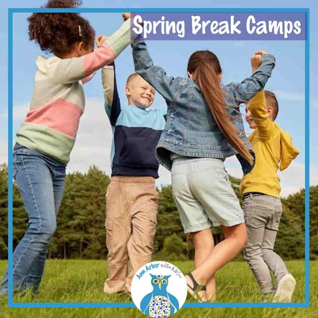 Spring Break Camps - Kids outside in a circle holding raised hands as they circle