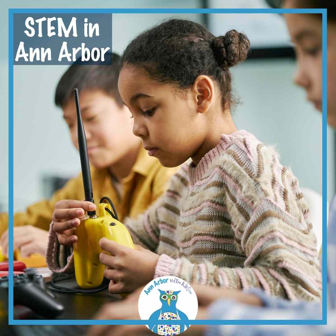 STEM in Ann Arbor - kids experiment with a radio & controllers