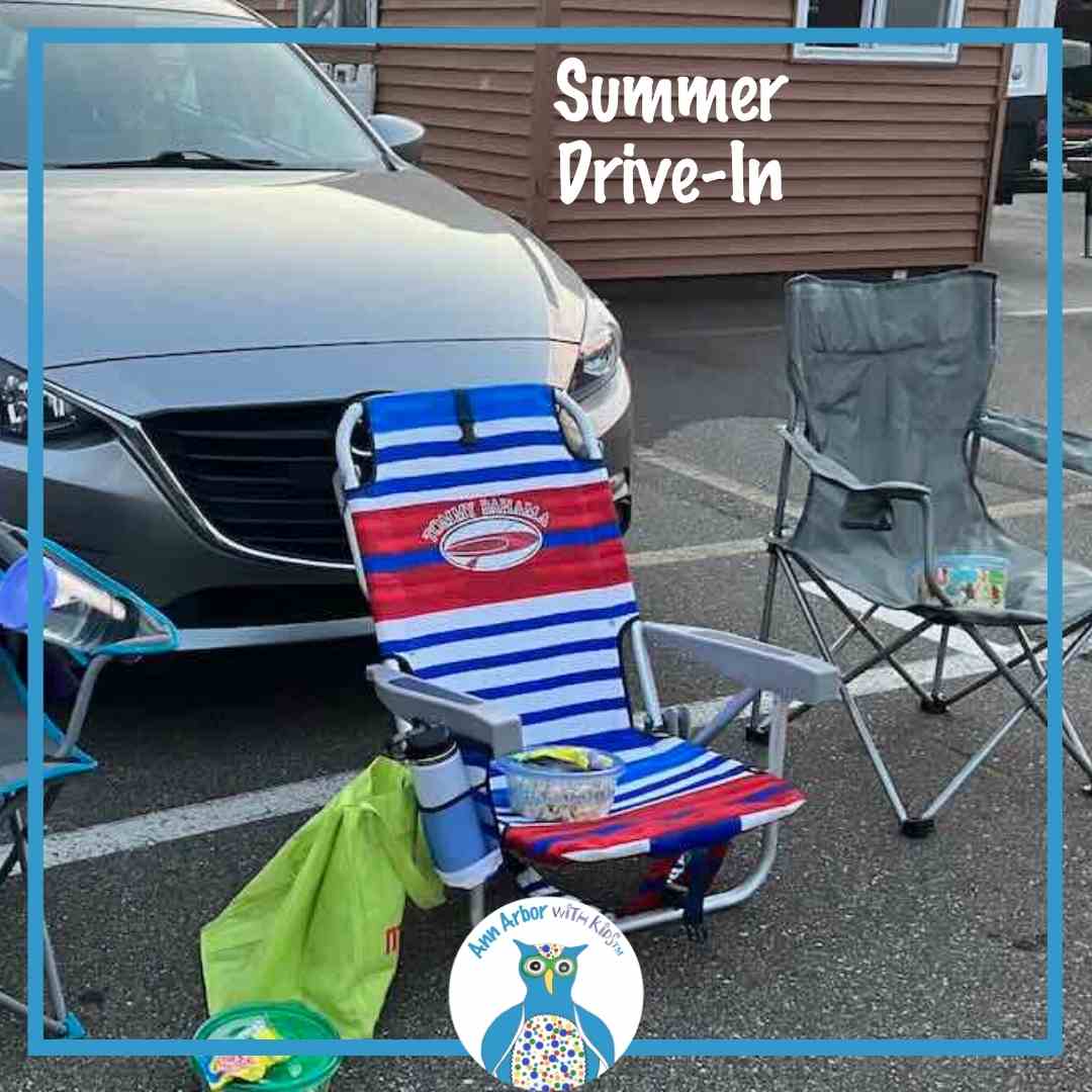 Summer Drive-In - a car with camp chairs placed in front of it at the summer drive-in