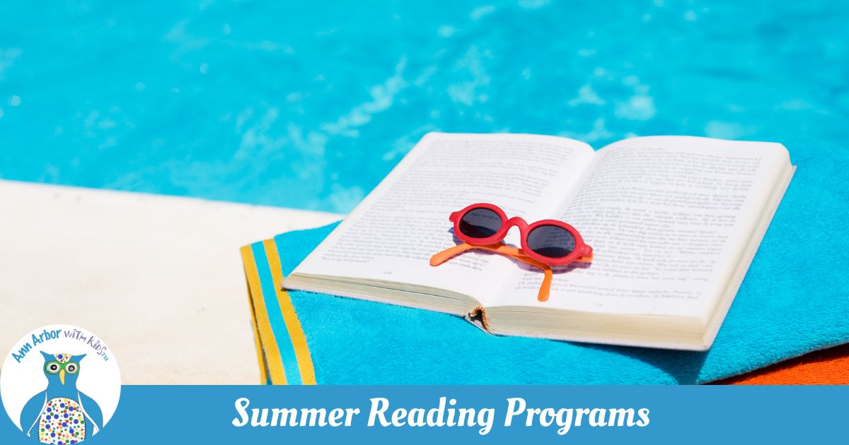 Summer Reading Programs - an open book with sunglasses on top sits ona. beach towel next to a pool.