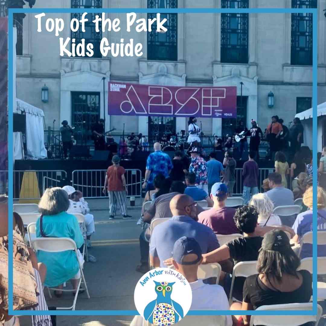 Top of the Park Kids Guide - families & adults sit in chairs or dance during music performance at A2SF Top of the Park on the steps of Rackham Graduate School