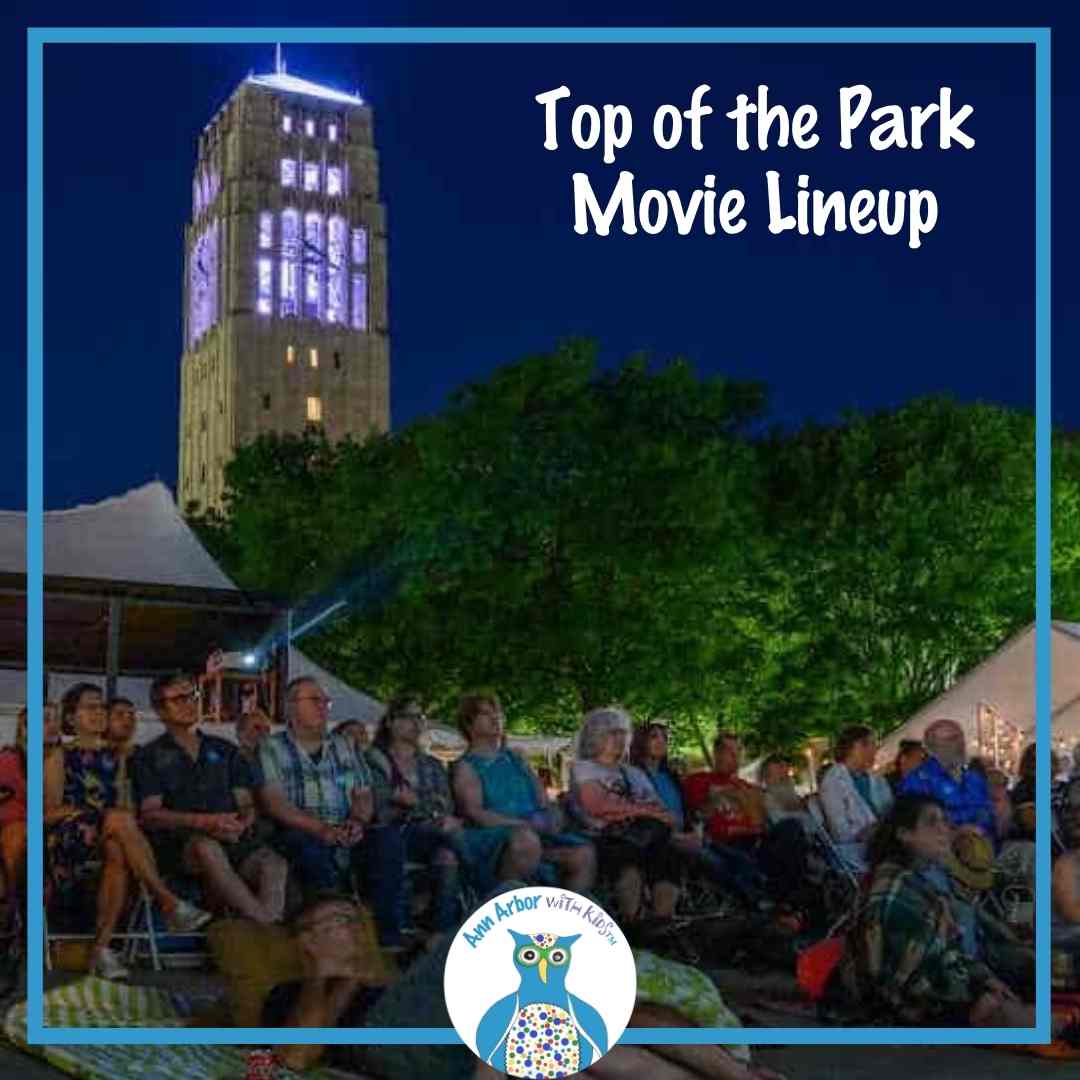 Top of the Park Movie Lineup - People sitting in front of the Bell Tower watching a movie